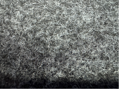 Nonwoven and carpet surface texture